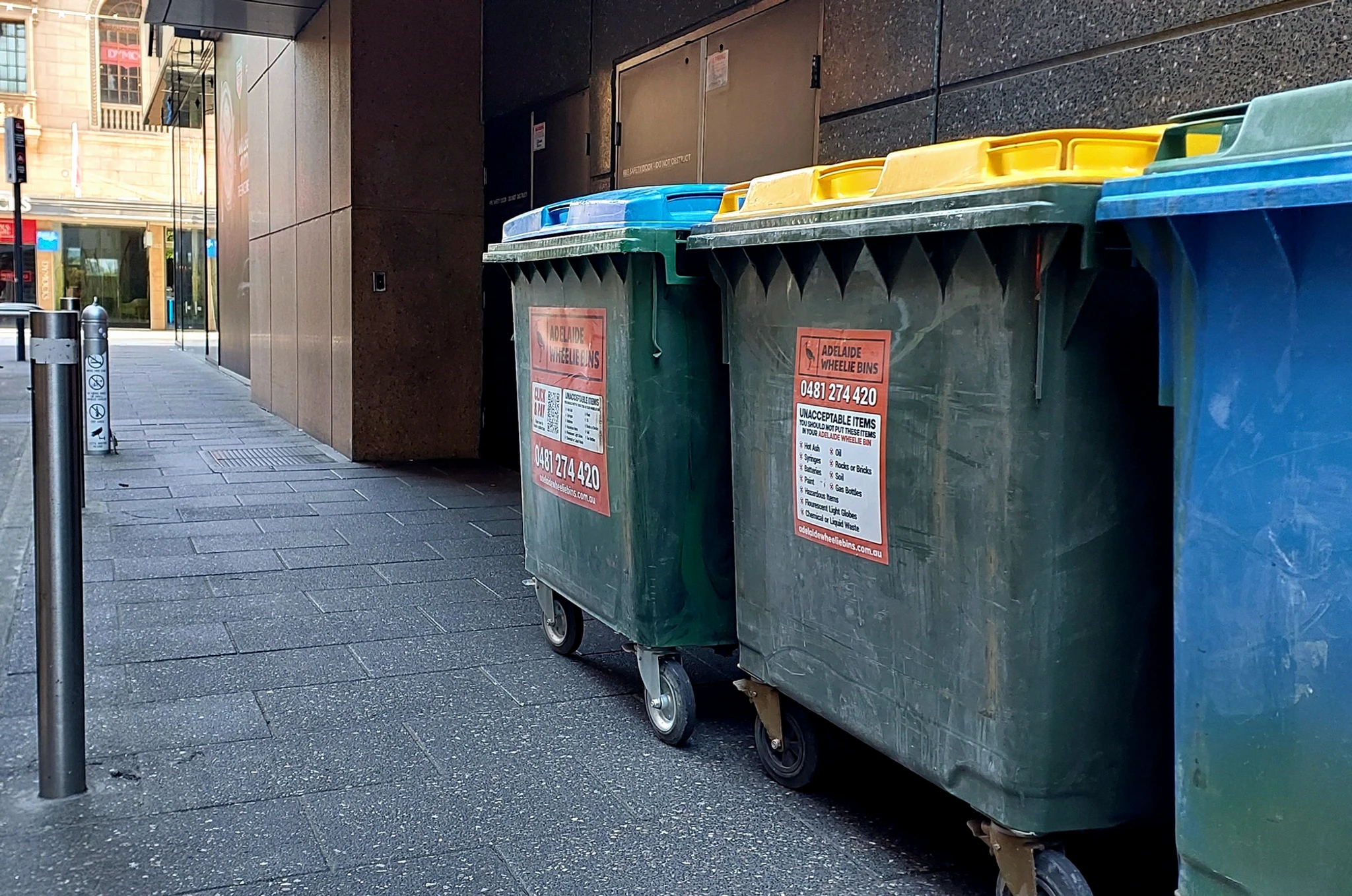 1100L wheelie bins in an Adelaide CBD laneway waiting for collection