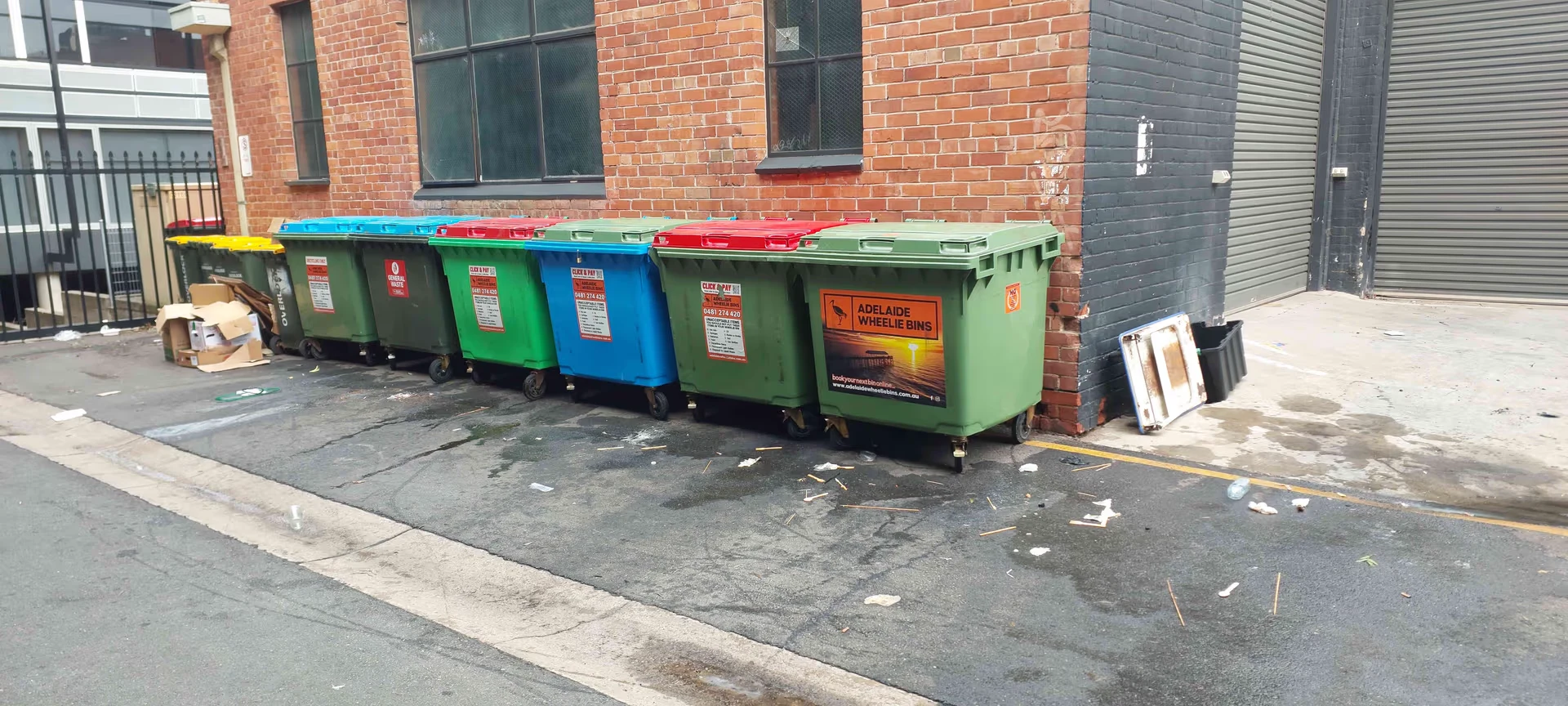 Adelaide Wheelie Bins commercial bins lined up in a city laneway
